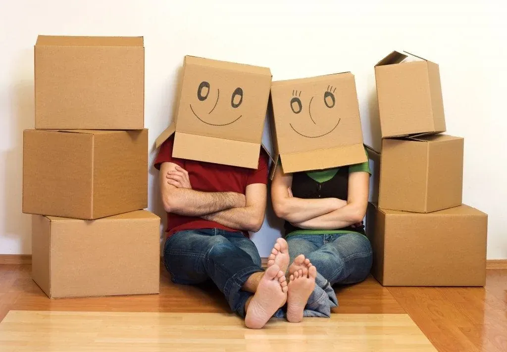 Couple with smiley boxes on heads