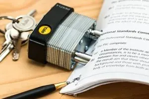 Padlock, keys and contract document