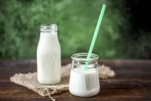 Milk bottle and jar with straw