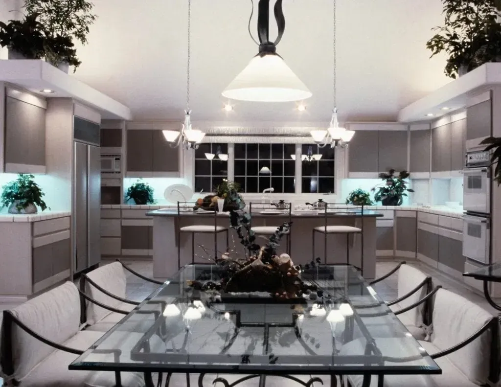 Upscale kitchen interior with glass dining table