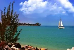 Sailboat on turquoise coastal water