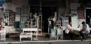 Antique shop storefront with signs