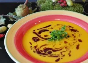 Pumpkin soup in colorful bowl