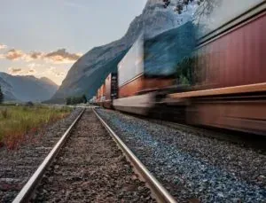 Freight train blurred in mountains