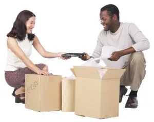 Two people packing plain boxes