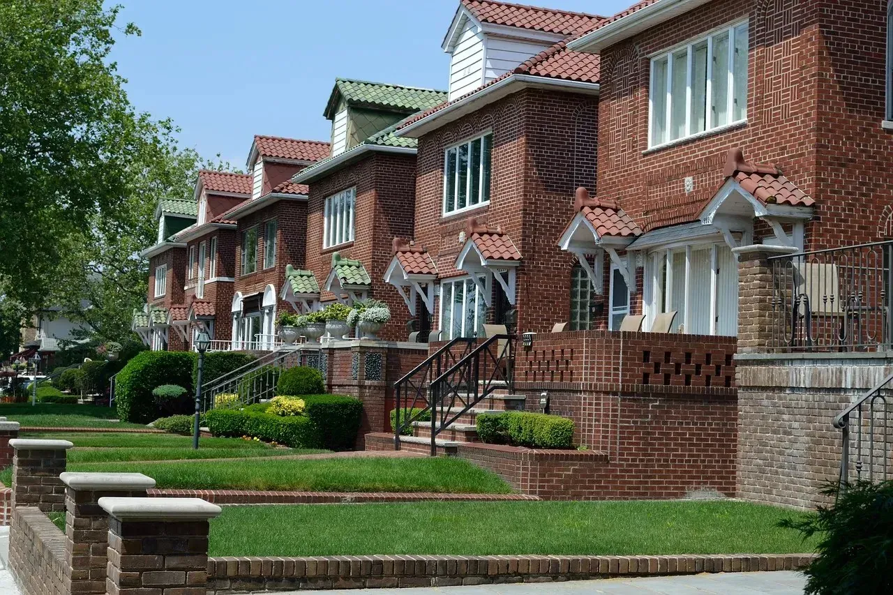 Row of brick homes with landscaped front yards