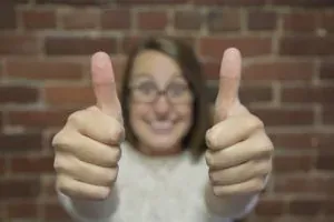 Woman giving two thumbs up