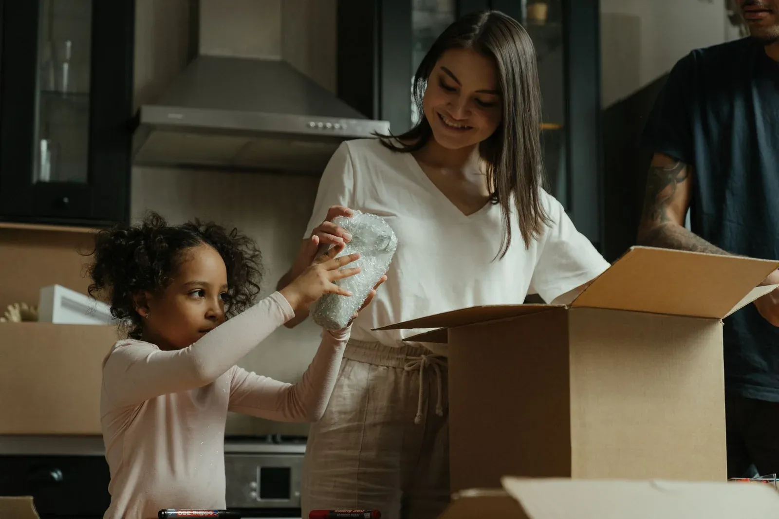 Woman holding plain cardboard box