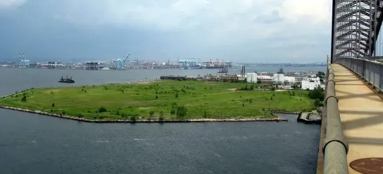 Harbor view of Bayonne peninsula with distant port cranes