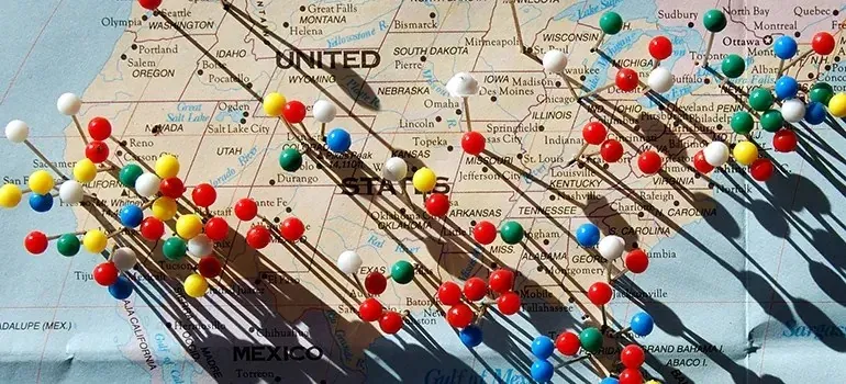 United States map covered with colorful push pins