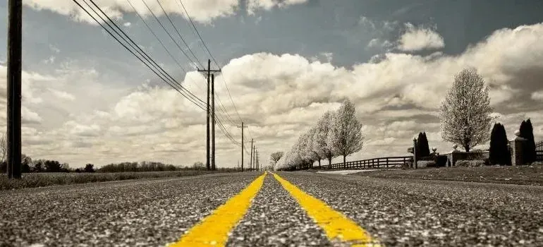 Low-angle rural road with double yellow lines