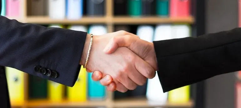 Business handshake close-up in office