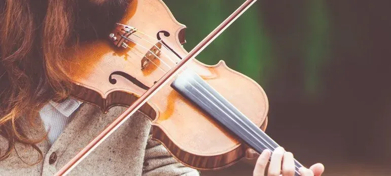 Close-up woman playing violin