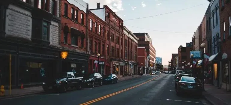 Historic downtown street, brick storefronts and parked cars