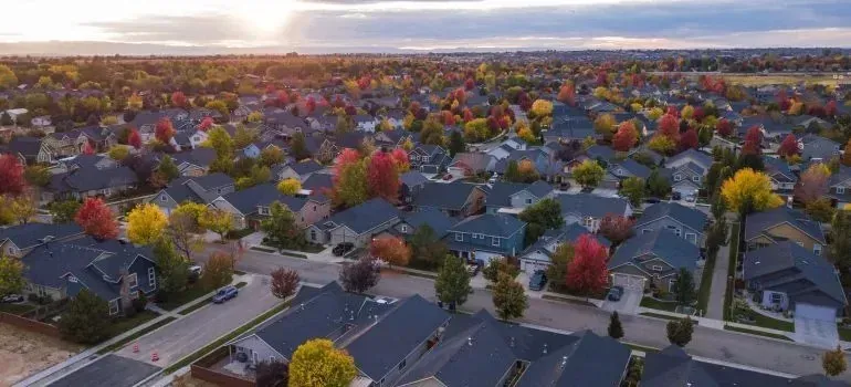 Aerial view of suburban neighborhood with colorful autumn trees