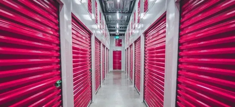 Corridor of pink self-storage unit doors