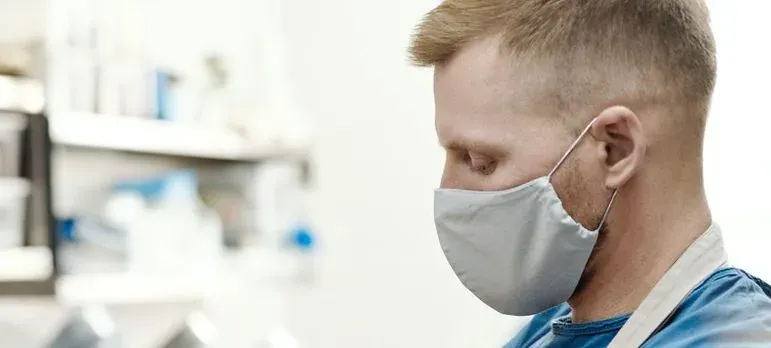 Man in face mask, side profile