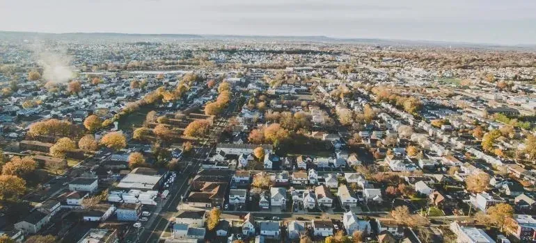 Aerial view of suburban neighborhood with autumn trees