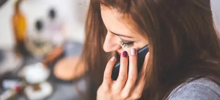 Close-up of woman talking on a phone