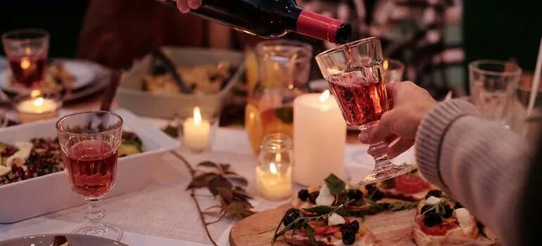 Wine poured at candlelit dinner table