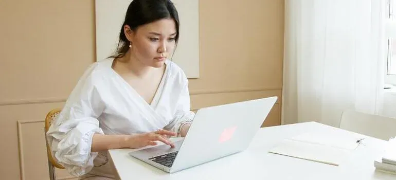 Woman working on laptop at desk