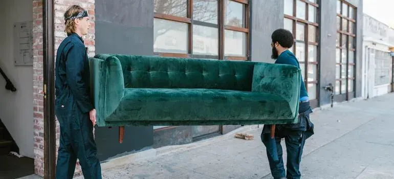 Movers carrying boxes into a New Jersey home in spring