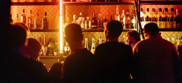 Crowd at dimly lit bar