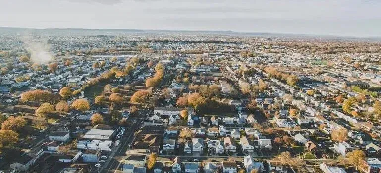 Aerial view of sprawling suburban neighborhood in autumn