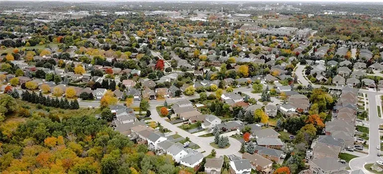 Aerial view of suburban neighborhood with autumn trees
