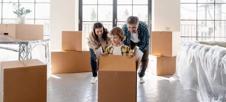 Family with child in moving box
