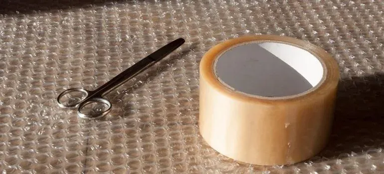 Scissors and tape on bubble wrap