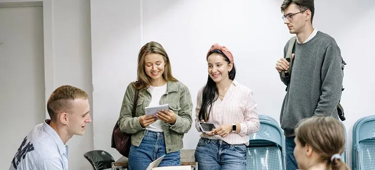 Group of students chatting indoors