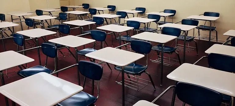 Empty classroom desks and chairs