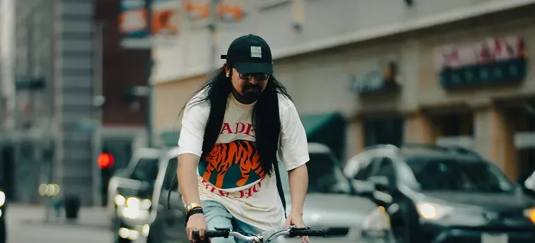 Man cycling on city street