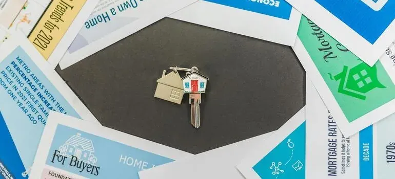 House key on real estate brochures