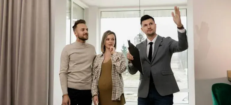 Agent showing apartment to couple