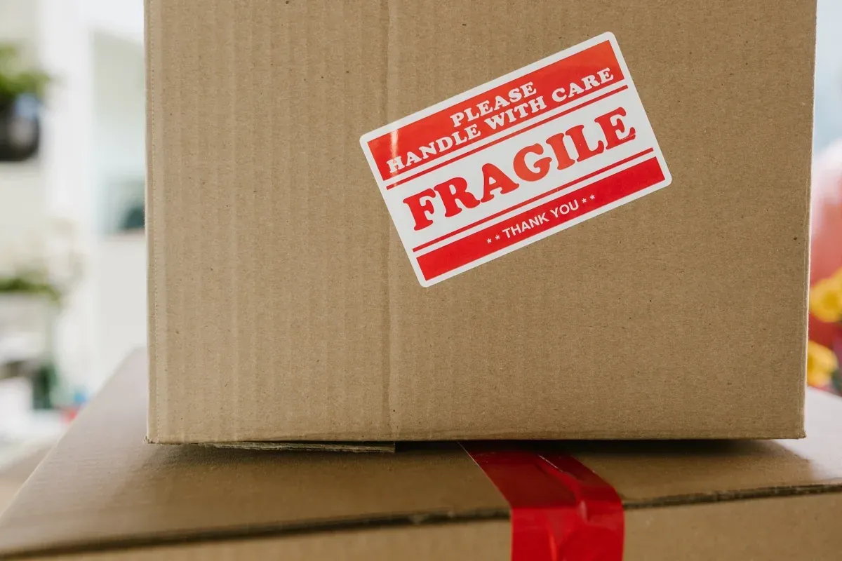 Fragile household items wrapped and packed into boxes for a move