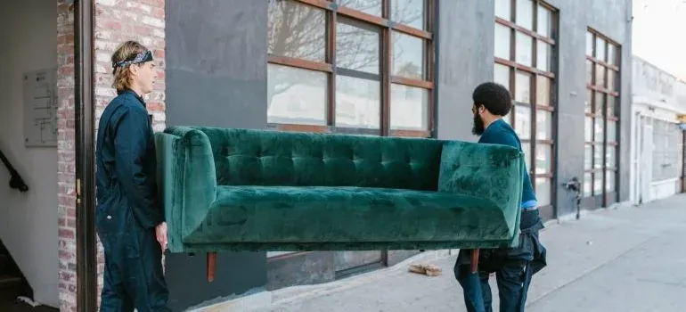Movers carrying boxes into a New Jersey home