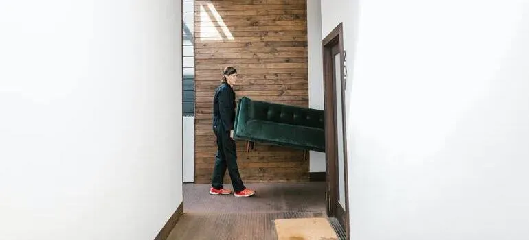 Movers carrying boxes into a New Jersey home