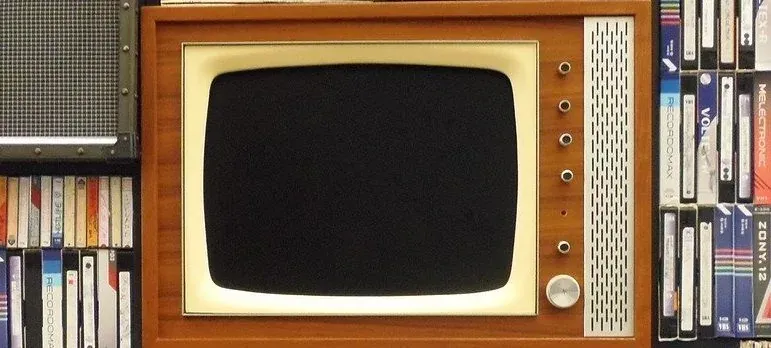 Vintage TV set with VHS tapes