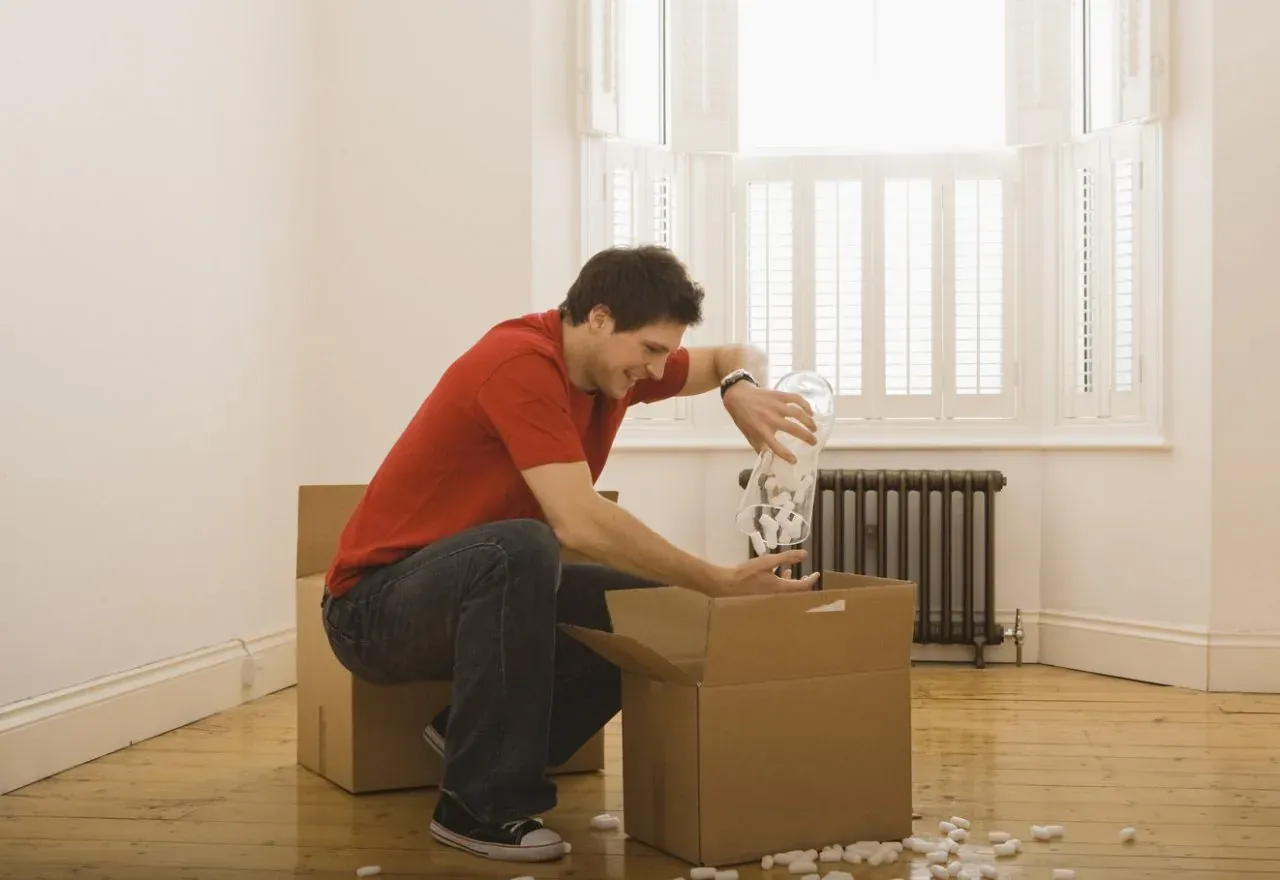 Movers carrying boxes into a New Jersey home