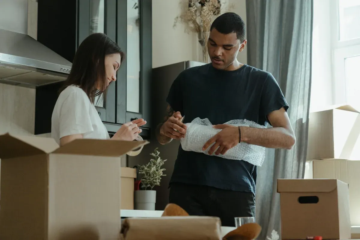 Movers carrying boxes into a New Jersey home