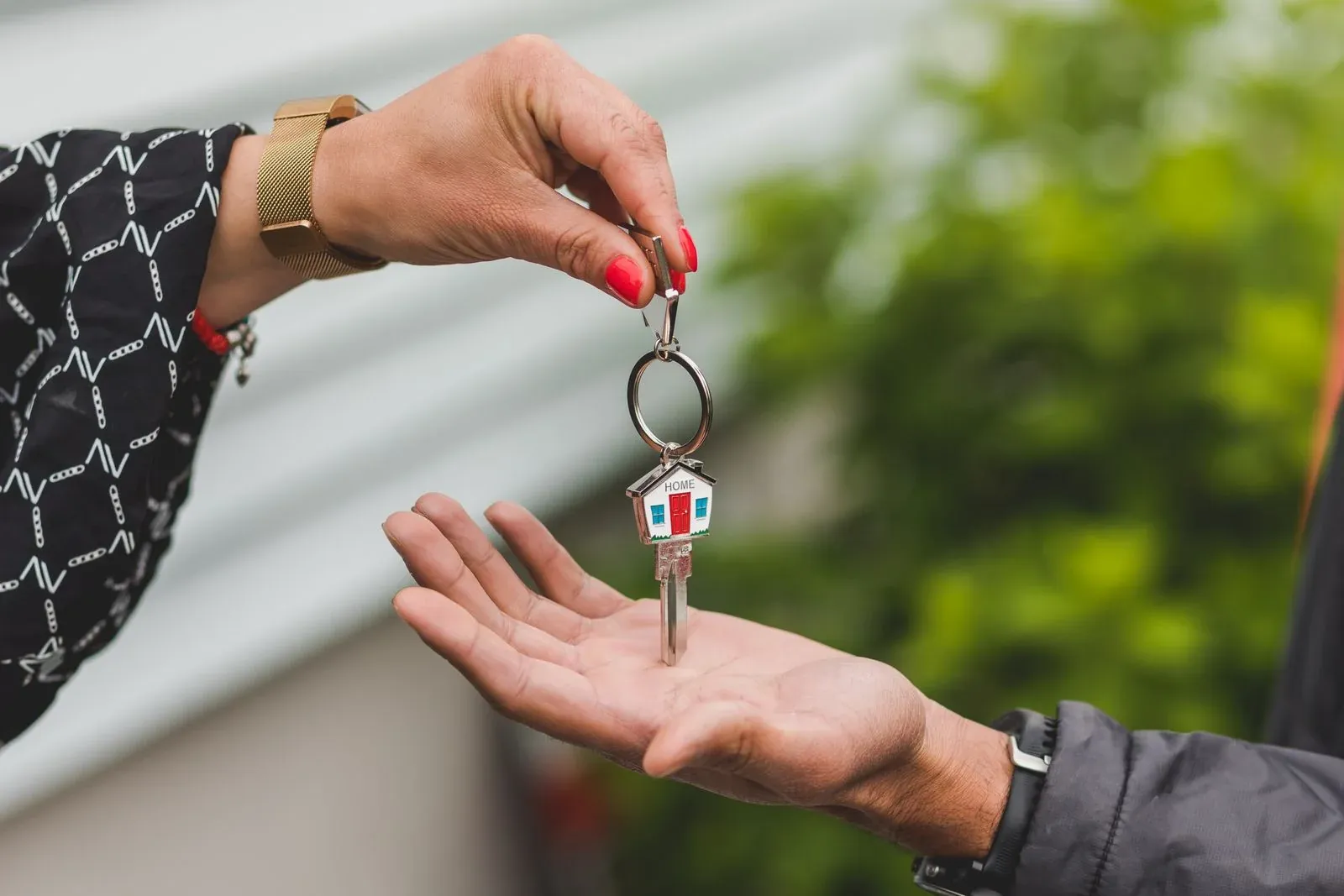 A real estate agent handing over the keys to a new home