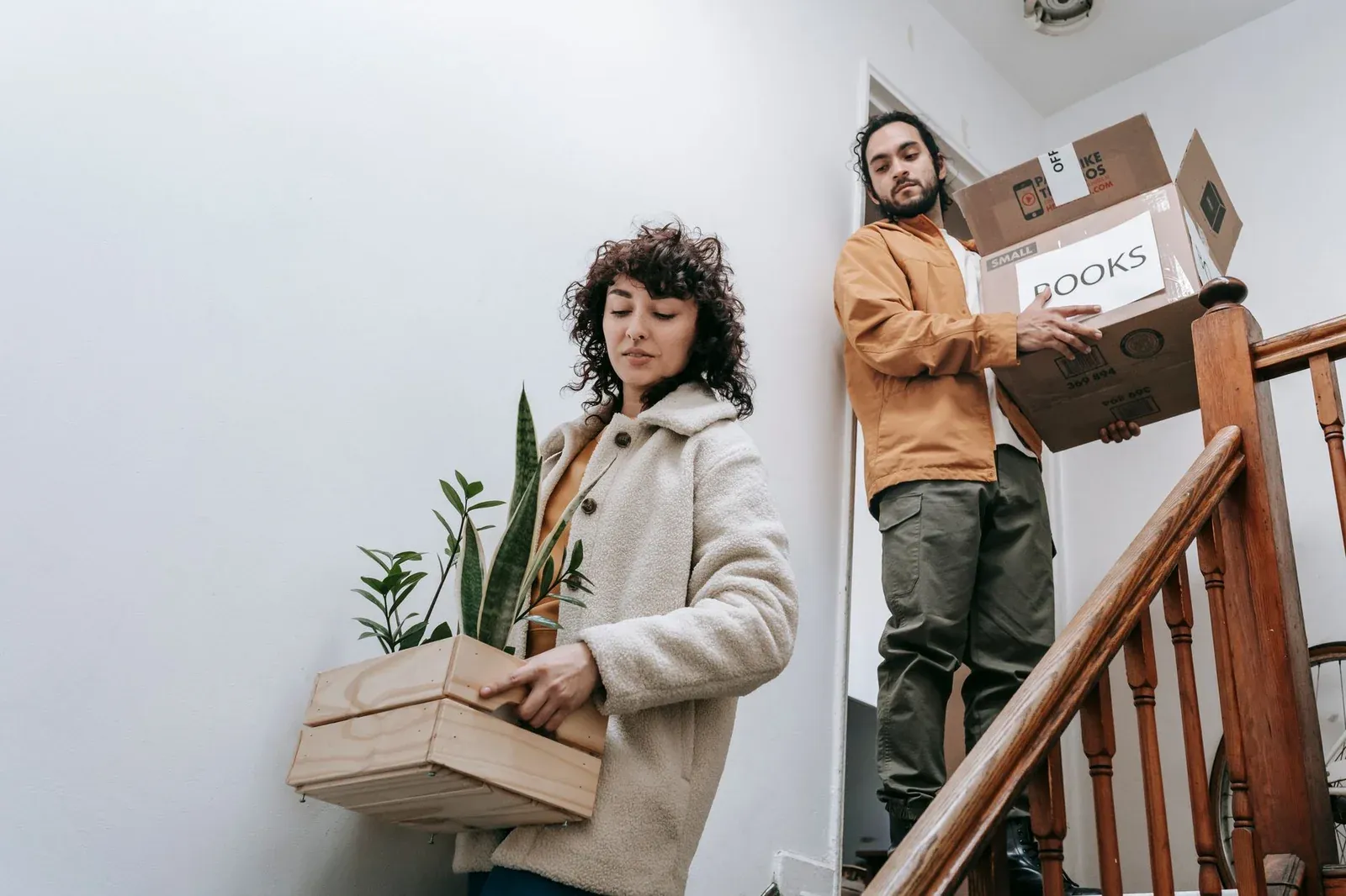 Movers carrying boxes into a New Jersey home