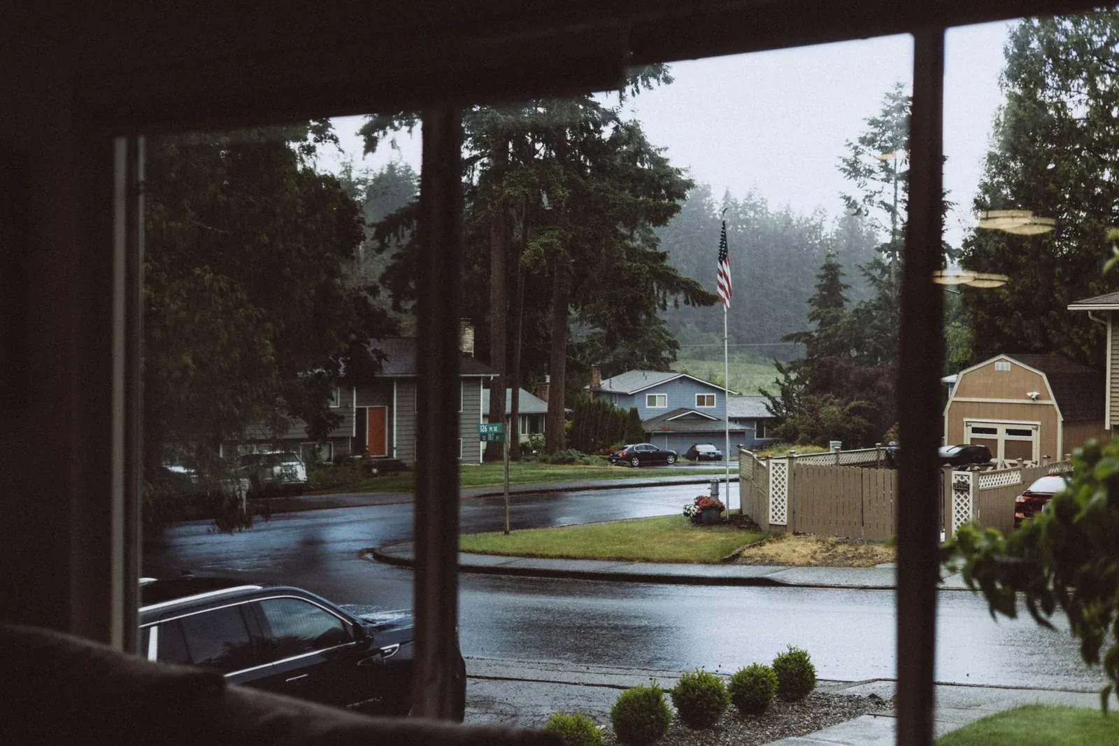 Movers carrying boxes to a truck on a rainy day in New Jersey